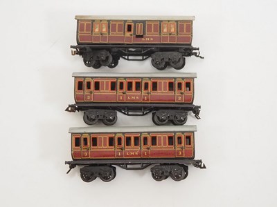 Lot 556 - A group of BING O gauge short bogie coaches in...