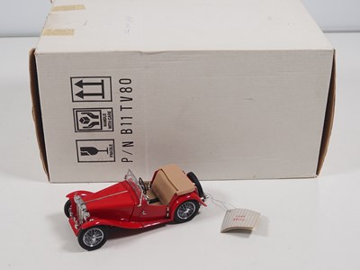 Lot 106 - A pair of diecast MG cars comprising an...