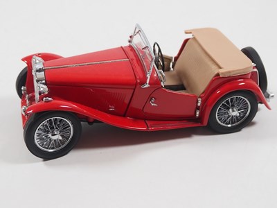 Lot 106 - A pair of diecast MG cars comprising an...