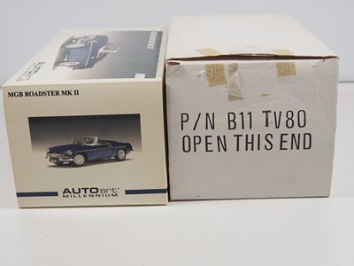 Lot 106 - A pair of diecast MG cars comprising an...
