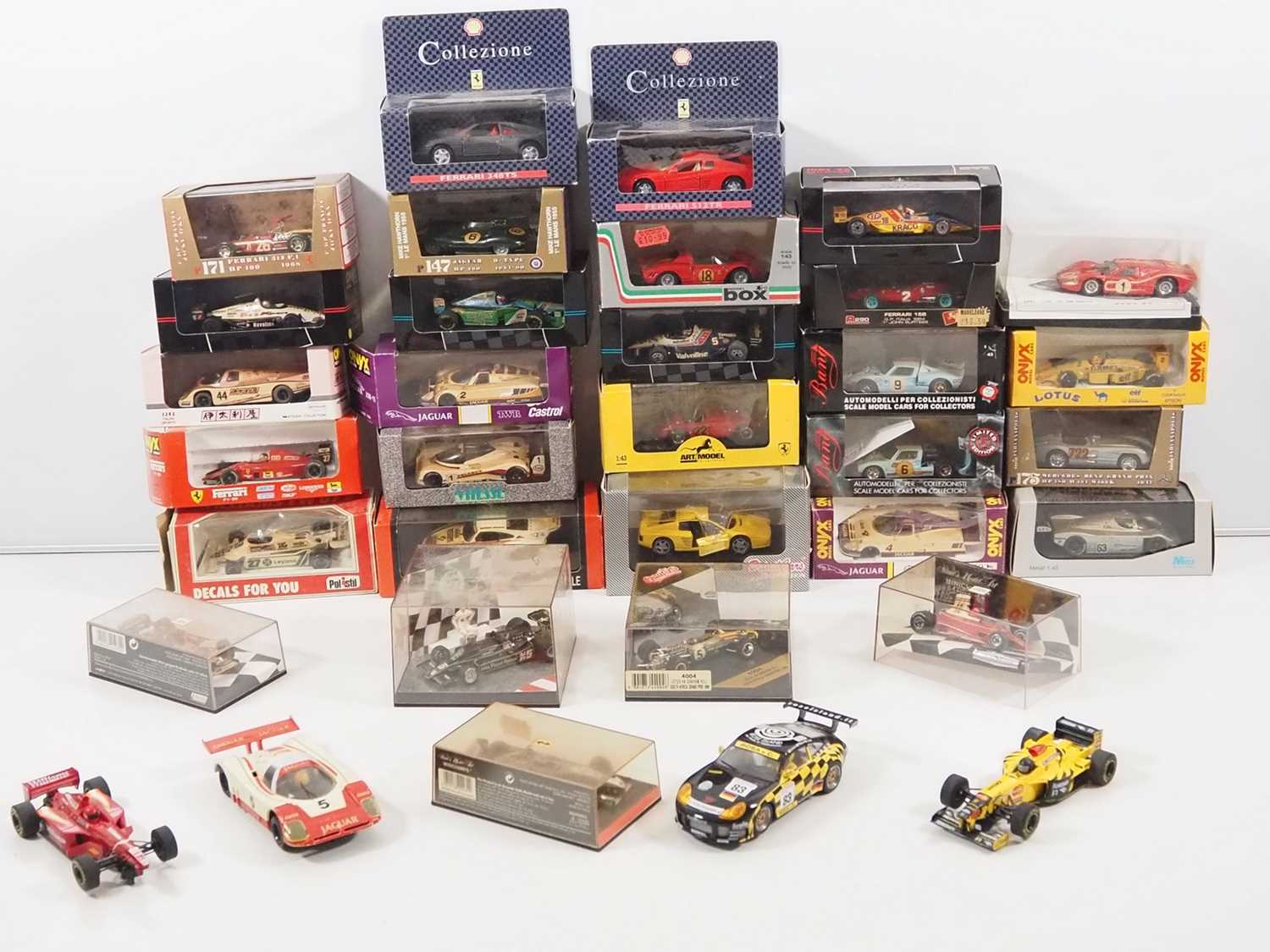 Lot 14 - A mixed group of boxed diecast racing cars by...