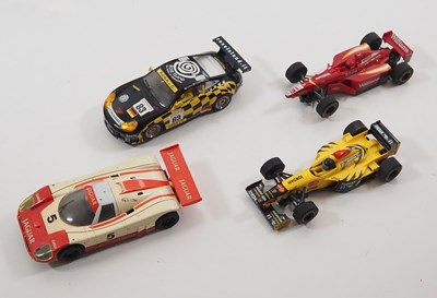 Lot 14 - A mixed group of boxed diecast racing cars by...