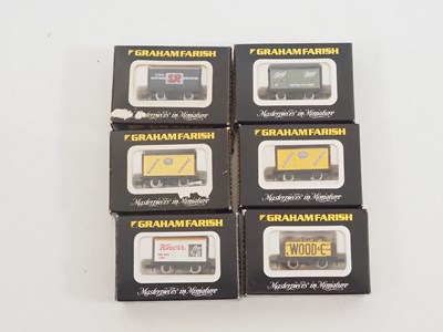 Lot 2 - A group of GRAHAM FARISH N gauge wagons in...