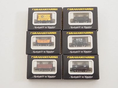 Lot 13 - A group of GRAHAM FARISH N gauge wagons in...