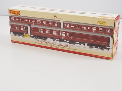 Lot 104 - A pair of HORNBY OO gauge triple coach packs...