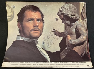 Lot 397 - ROBERT SHAW - An autographed lobby card from A...