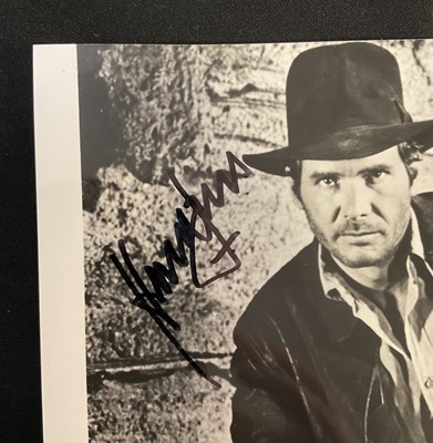 Lot 462 - HARRISON FORD - An autographed 8" x 10" black...