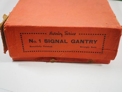 Lot 72 - A group of HORNBY O gauge tinplate buildings...