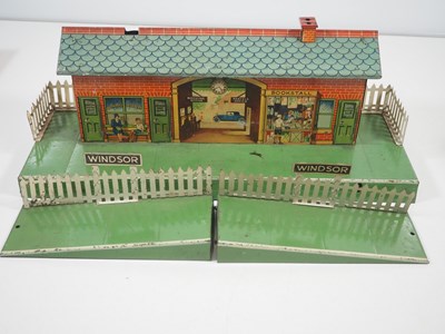 Lot 72 - A group of HORNBY O gauge tinplate buildings...