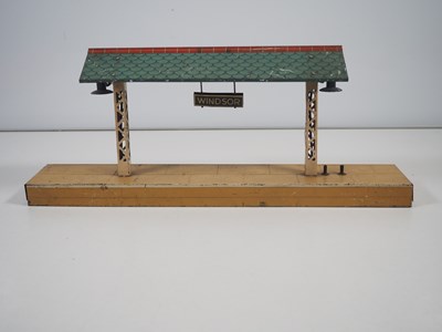 Lot 72 - A group of HORNBY O gauge tinplate buildings...
