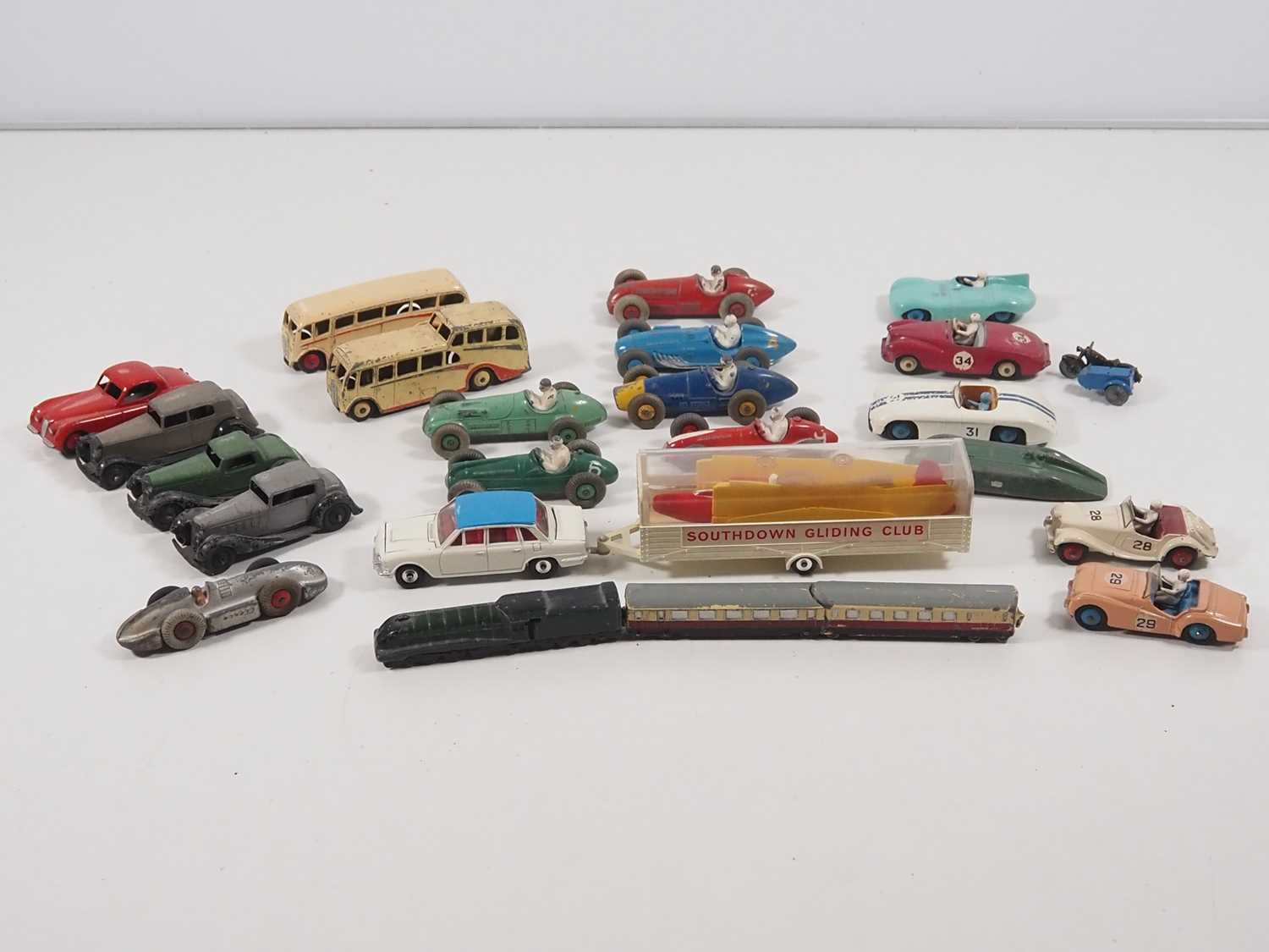 Lot 415 - A group of playworn diecast cars, buses etc by...