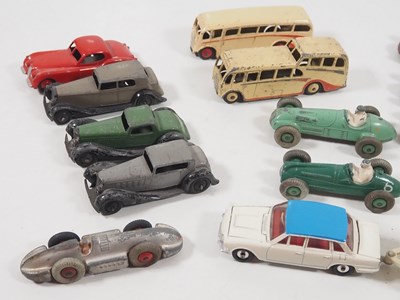 Lot 415 - A group of playworn diecast cars, buses etc by...