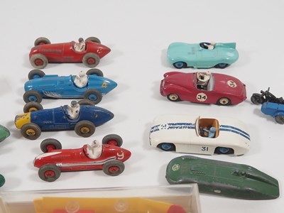 Lot 415 - A group of playworn diecast cars, buses etc by...