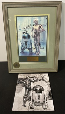 Lot 749 - A framed and glazed autographed colour still...