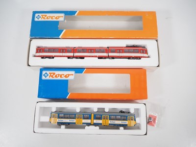 Lot 24 - A pair of ROCO HO gauge Duwag tram cars...