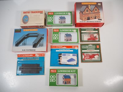 Lot 34 - A group of OO gauge plastic building kits and...