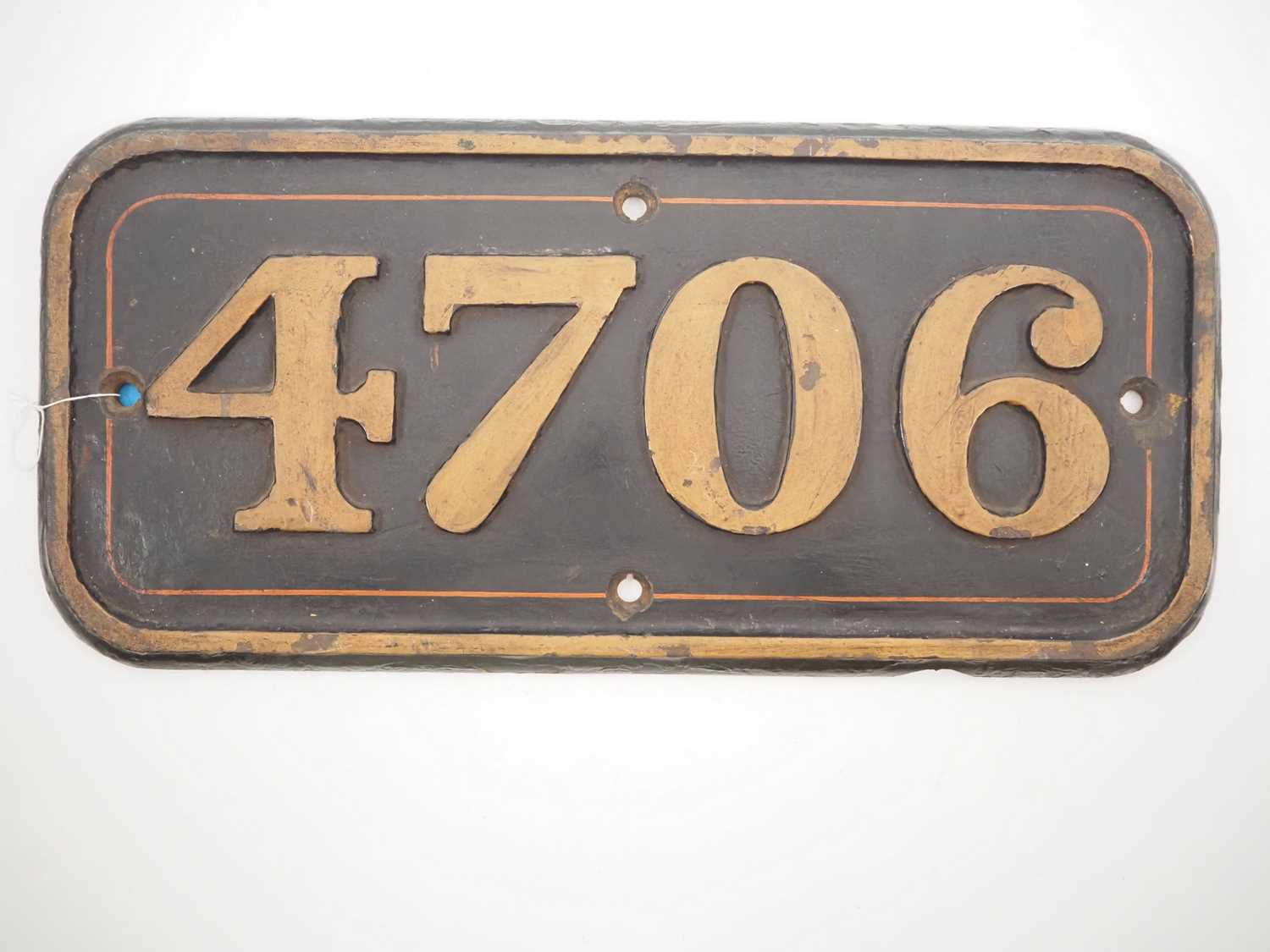 Lot 259 - A GWR cast iron cabside number 4706 from one...