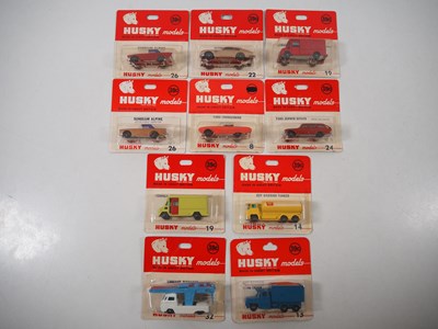 Lot 719 - HUSKY - A group of diecast vehicles sealed on...