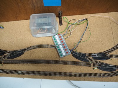 Lot 10 - An oval N gauge double sided test track with...