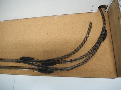 Lot 10 - An oval N gauge double sided test track with...
