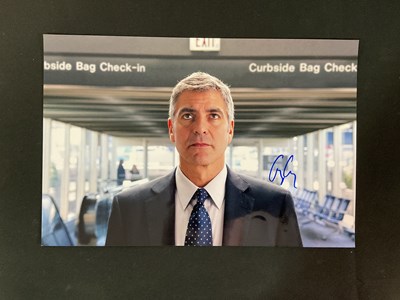 Lot 378 - A photograph of GEORGE CLOONEY, autographed in...