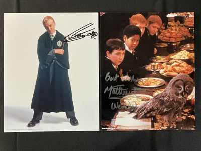 Lot 380 - A pair of HARRY POTTER autographs on 8" x 10"...
