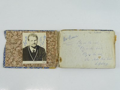 Lot 141 - A well worn autograph book with signatures to...