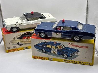 Lot 551 - DINKY - A pair of diecast North American...