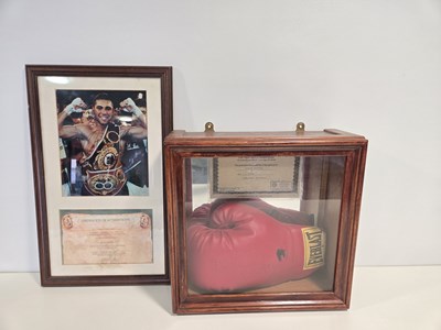 Lot 545 - A signed EVANDER HOLYFIELD boxing glove and...