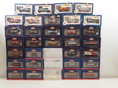 Lot 201 - BACHMANN OO gauge mixed wagons in various...