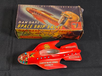 Lot 14 - METTOY - A boxed tinplate friction drive DAN...
