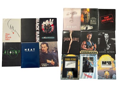 Lot 348 - A group of press packs complete with black and...