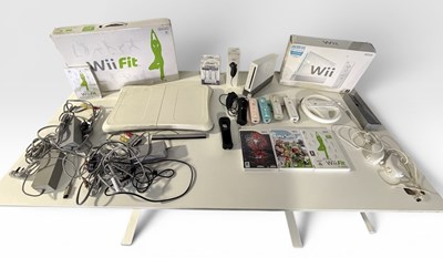 Lot 550 - NINTENDO WII LOT 2 - A boxed console with a...
