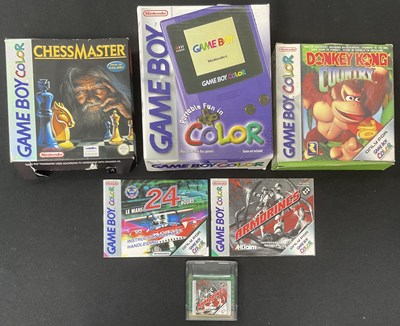 Lot 554 - A purple GAMEBOY COLOUR, boxed with DONKEY...