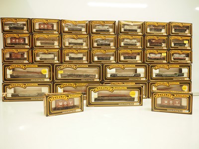 Lot 193 - A large group of OO gauge MAINLINE wagons,...