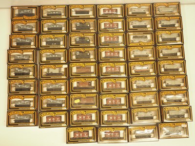 Lot 273 - A large group of OO gauge MAINLINE wagons,...
