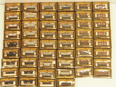 Lot 274 - A large group of OO gauge MAINLINE wagons,...