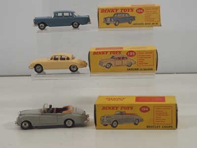Lot 461 - DINKY - A group of three diecast vehicles...