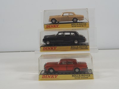 Lot 472 - DINKY - A group of three diecast luxury...