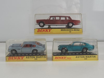 Lot 473 - DINKY - A group of three diecast luxury...