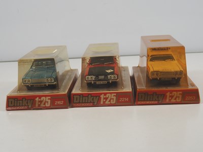 Lot 570 - A group of three DINKY 1:25 scale diecast Ford...