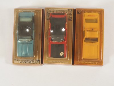 Lot 570 - A group of three DINKY 1:25 scale diecast Ford...