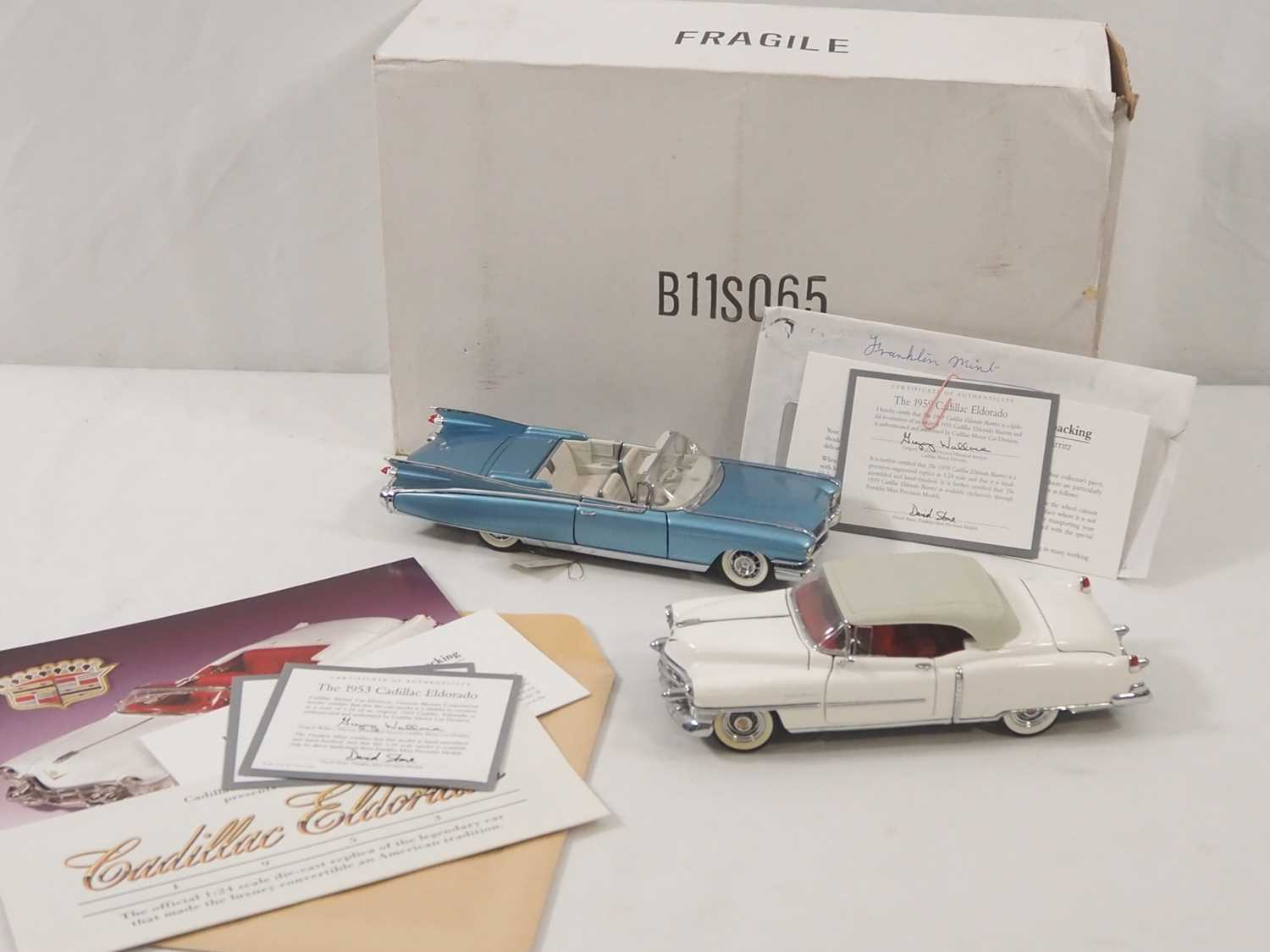 Lot 654 - A pair of FRANKLIN MINT 1:24 scale Cadillac