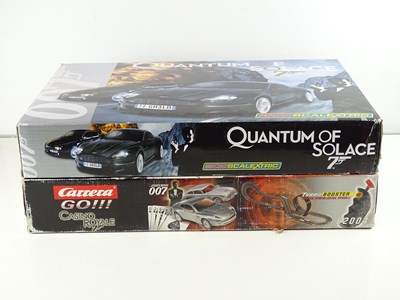 Lot 94 - A pair of James Bond Movie Tie-In Slot Racing...